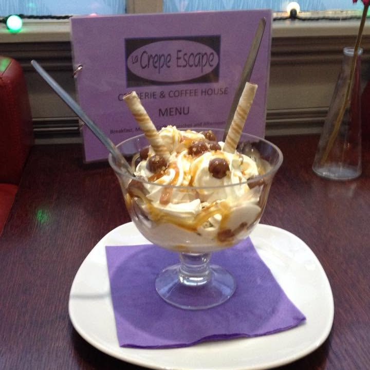 An ice cream sundae with a wafer curl